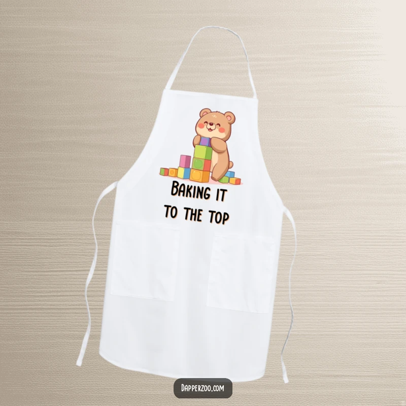Funny apron with a happy bear building a precarious tower of colorful blocks, perfect for a fun gift.