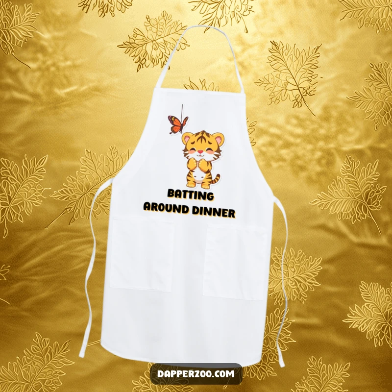 Funny apron showing a playful tiger cub batting at a dangling butterfly, perfect for kitchen adventures.
