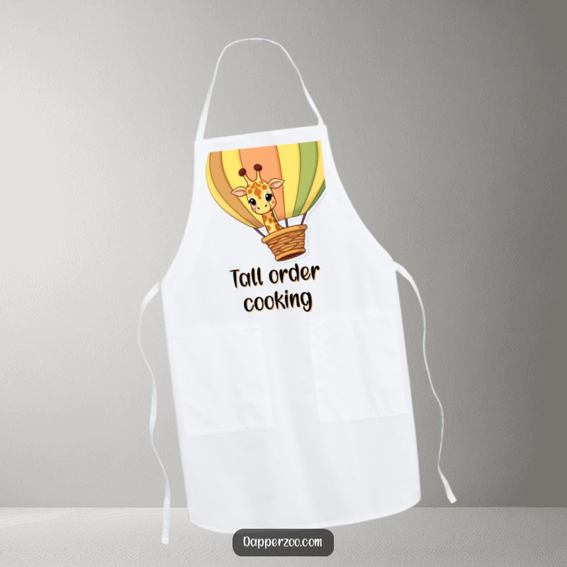 Funny giraffe apron featuring a curious giraffe character peeking over a giant, colorful hot air balloon basket, perfect for kitchen journeys.