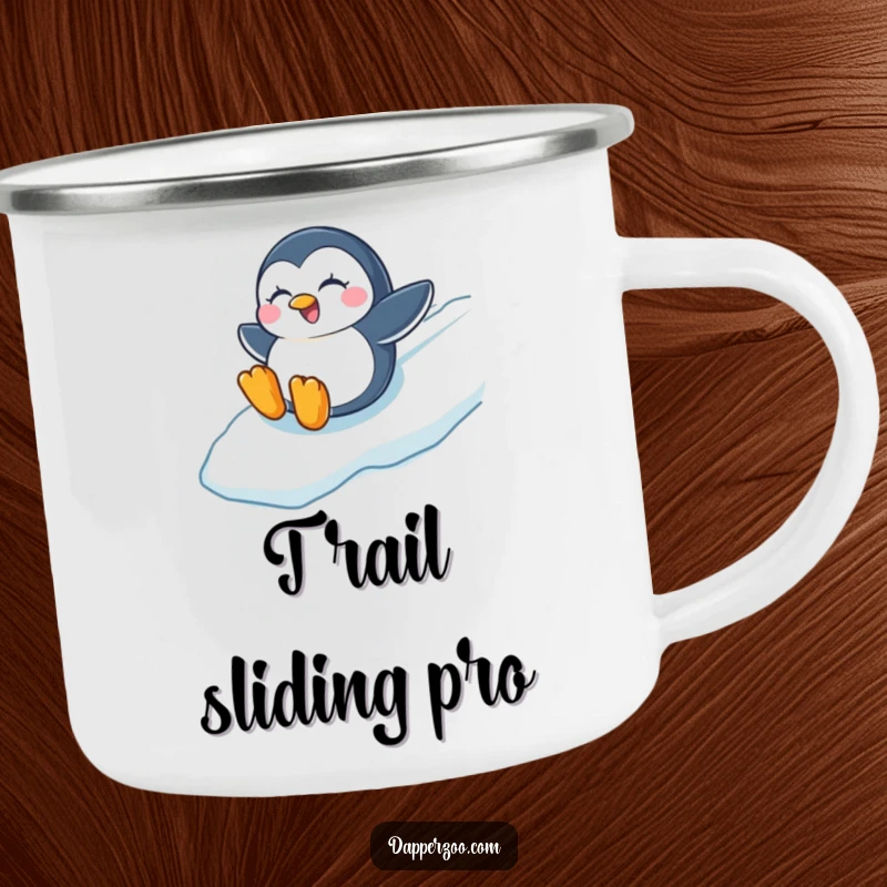 Funny camping mug showing a winking penguin sliding with joy down an icy slope, perfect for winter adventures.