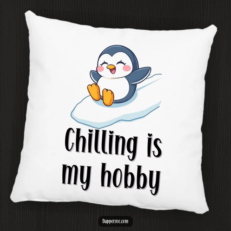 Funny pillow featuring a winking penguin joyfully sliding down an icy slope, adding a touch of winter fun.