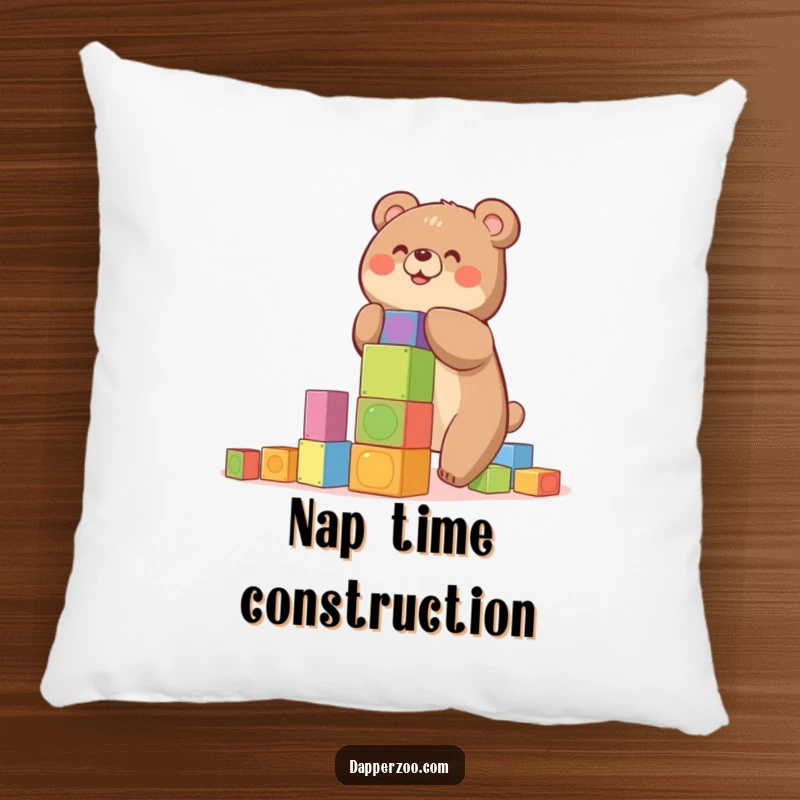 Funny pillow featuring a happy bear building a precarious tower of colorful blocks, a cheerful gift.