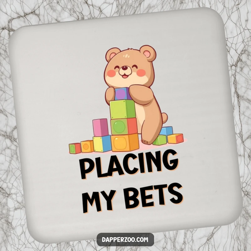 Funny coaster featuring a happy bear building a precarious tower of colorful blocks, a humorous accessory.