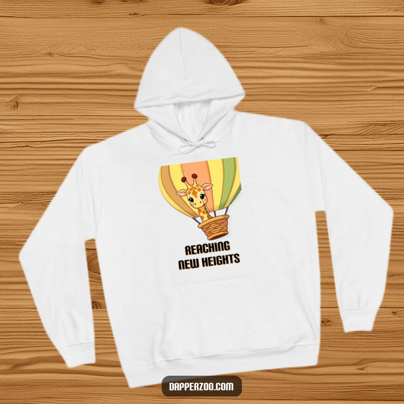 Funny giraffe hoodie featuring a curious giraffe character peeking inquisitively over the edge of a large, colorful hot air balloon basket.