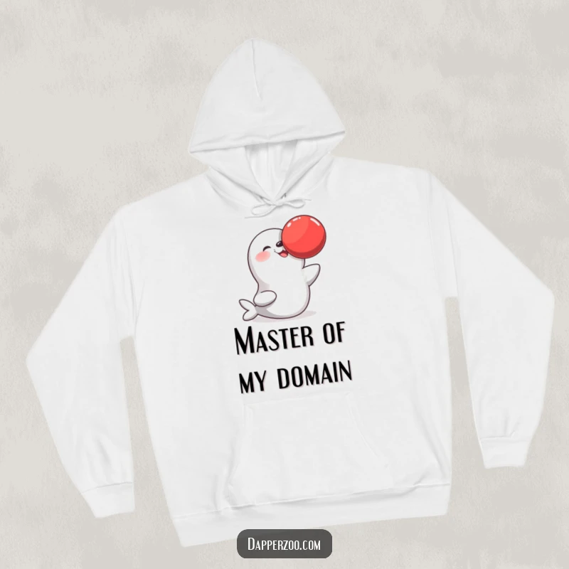 Funny hoodie showcasing a joyful seal character skillfully balancing a big red ball on its nose, a heartwarming and humorous scene.