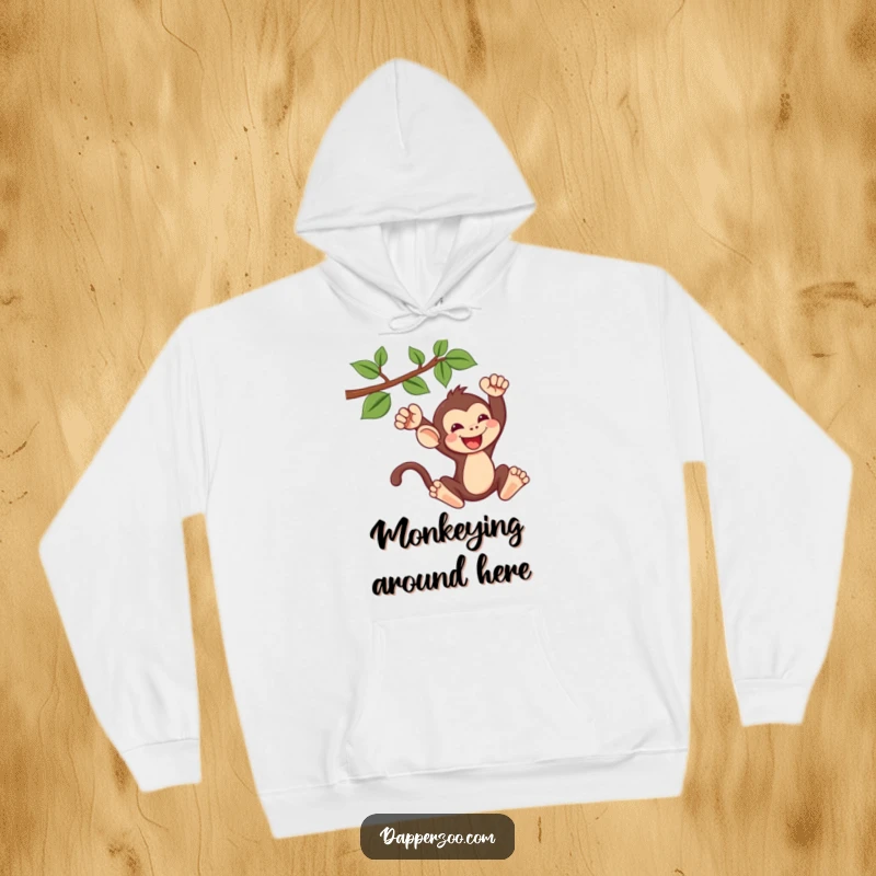 Funny kawaii monkey hoodie showing a cute monkey gleefully swinging from a vine, perfect for cozy and adventurous moments.
