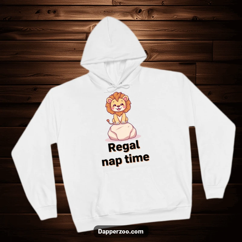 Funny happy lion character dramatically posing on a tiny plush rock with regal flair, featured on a cozy hoodie.