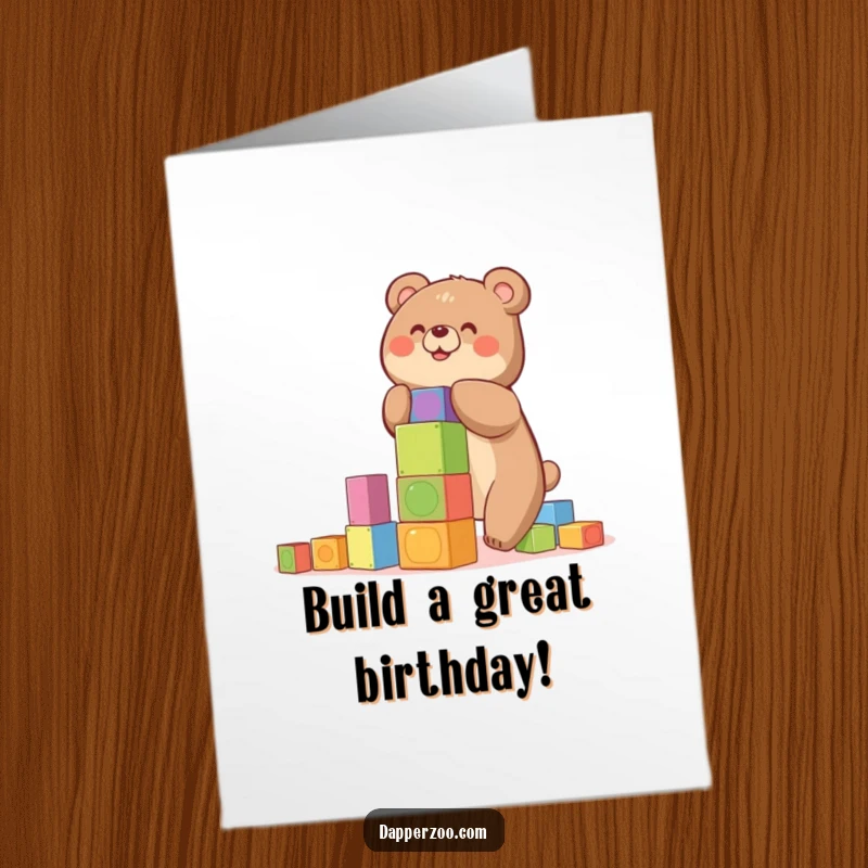 Funny free printable birthday card: A happy bear tries to build a tall, precarious tower of colorful blocks.