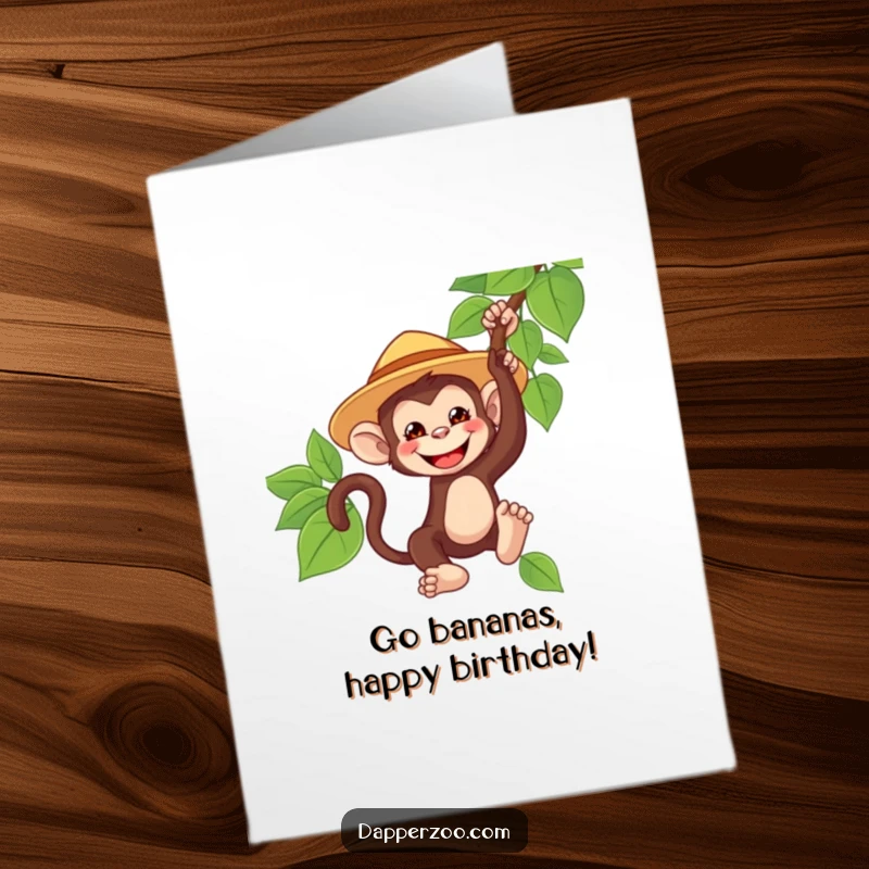 Funny Free Printable Birthday Card: A playful monkey in a safari hat swinging from a vine with a huge grin, ready for adventure.