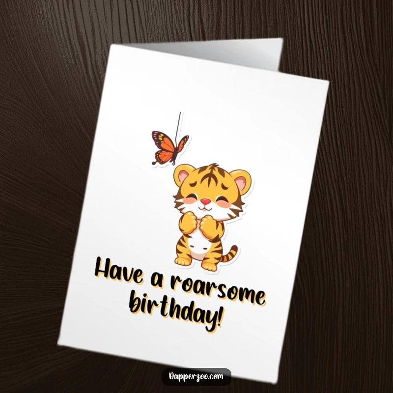 Funny Free Printable Birthday Card: A playful tiger cub playfully bats its paws at a colorful dangling butterfly.