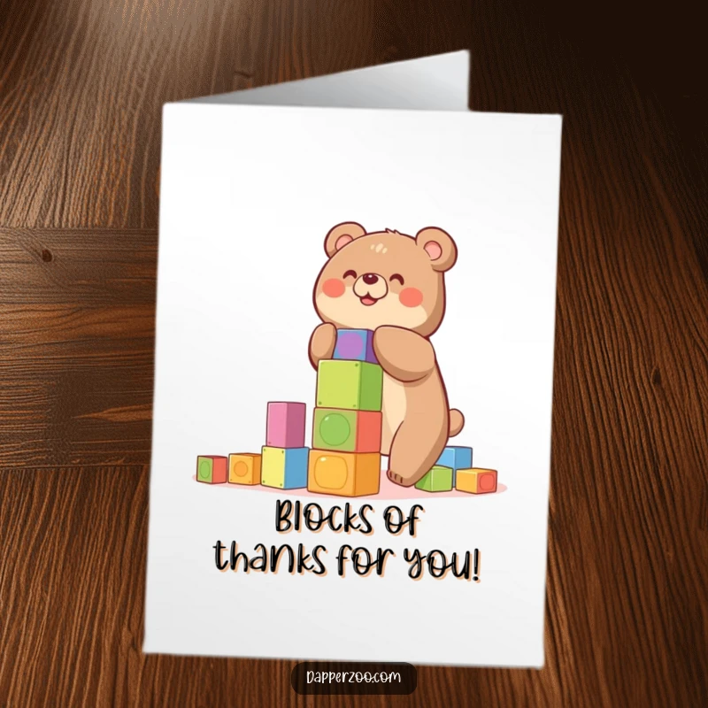Funny free printable thank you card: A happy bear carefully stacks colorful blocks, building a wobbly tower.