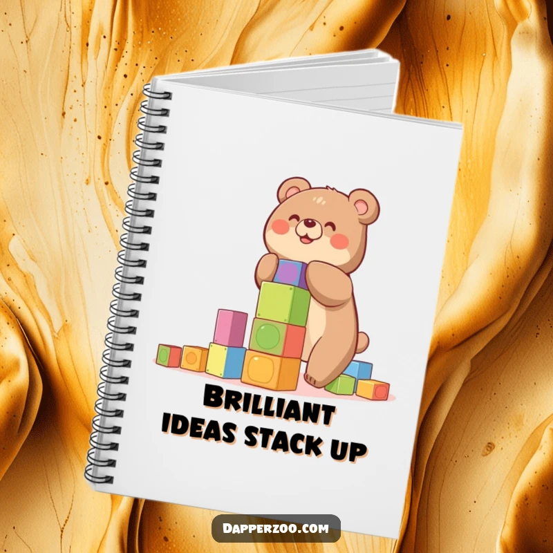 Funny notebook with a happy bear building a precarious tower of colorful blocks, ideal for creative notes.
