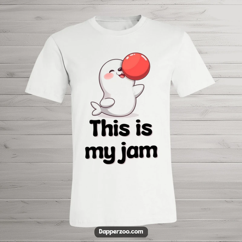 Funny t-shirt with a happy seal balancing a large red ball on its nose, showcasing its amazing playful talent and cheerful demeanor.