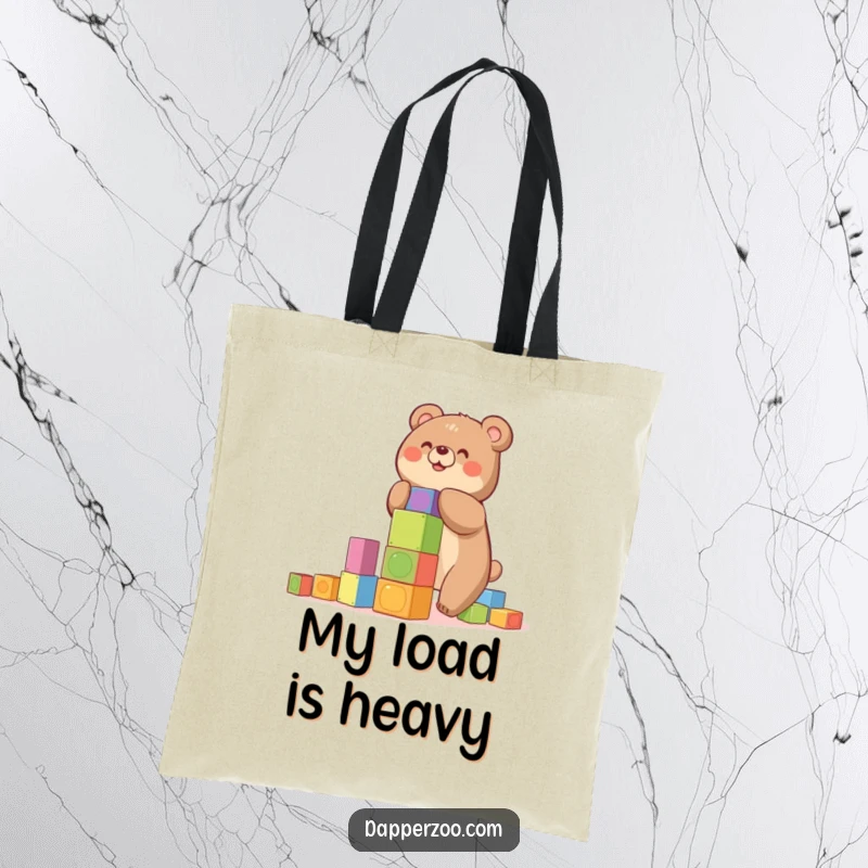 Funny tote bag showcasing a happy bear building a precarious tower of colorful blocks, a humorous accessory.
