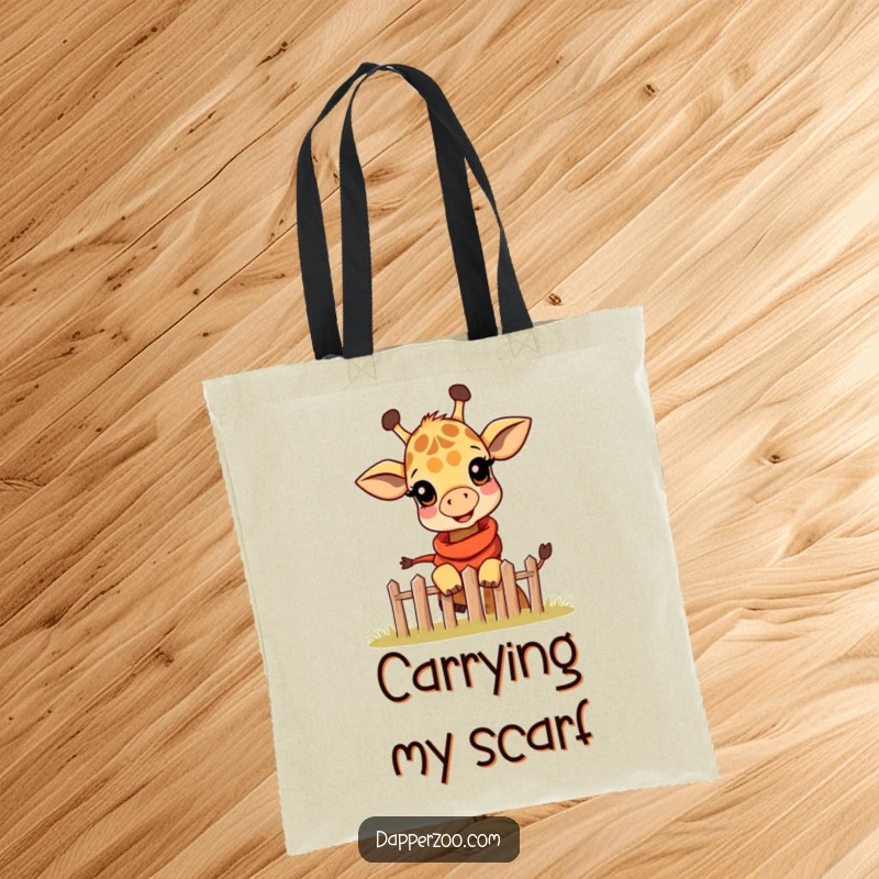 Funny tote bag showcasing a happy giraffe calf wearing a miniature scarf, playfully peeking over a tiny fence.