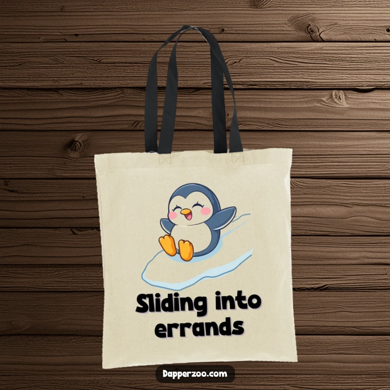 Funny tote bag with a winking penguin sliding down an icy slope, capturing the essence of winter fun and excitement.